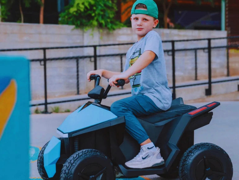 Kid Smiling while Riding on The Blue Mongoose ATV Quad by Tough Trucks For Kids