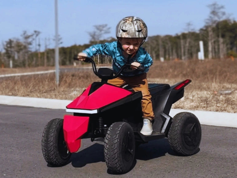 Action Pic of a Kid Wearing Camou Helmet on The Pink Mongoose ATV Quad by Tough Trucks For Kids