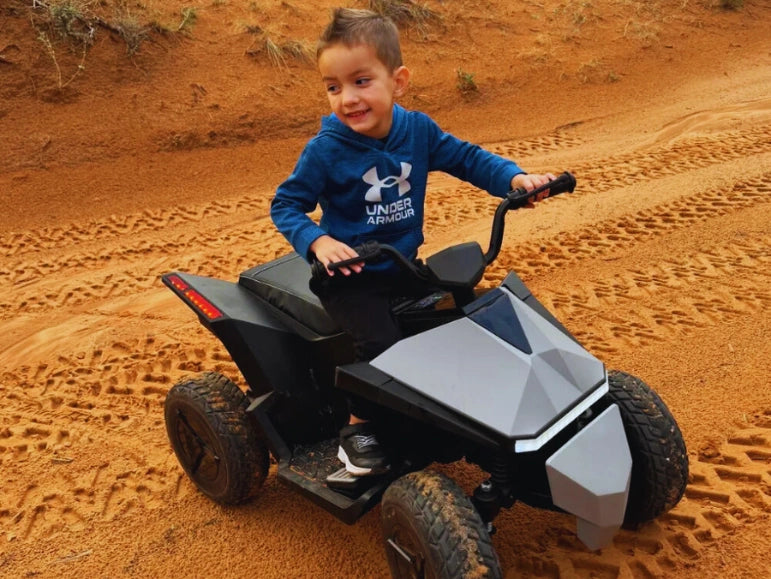 Kid Riding The Silver Mongoose ATV Quad by Tough Trucks For Kids