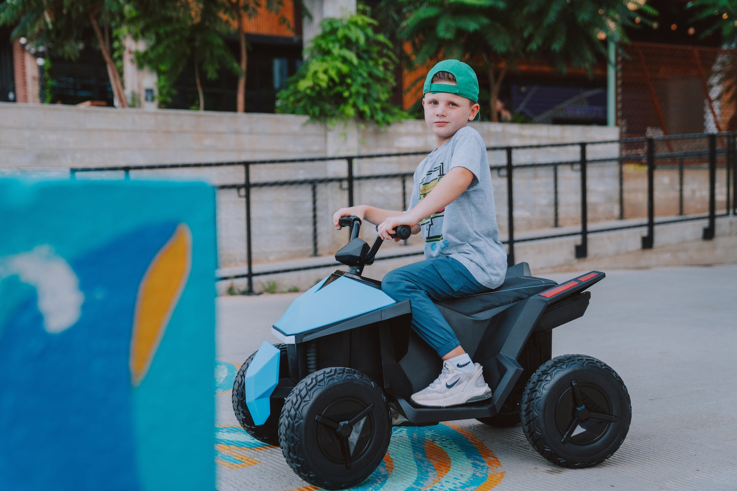 kids playing with electric cars outdoors