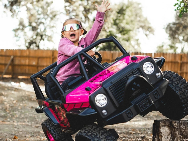 Action Pic of a Girl Riding The Off-Road Queen Pink Jeep 4x4 by Tough Trucks